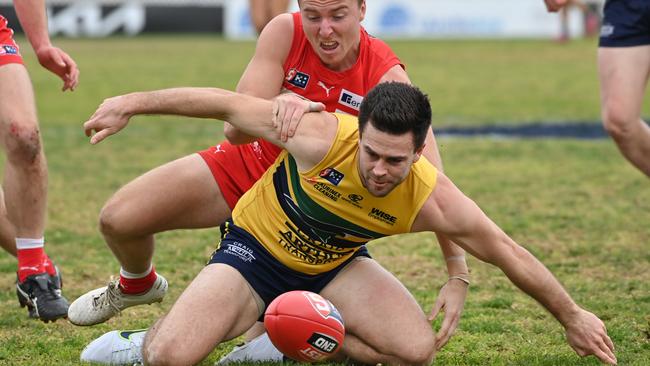 Eagles veteran Matthew Goldsworthy under pressure from Rooster Sam Thorne in North’s big win at Prospect Oval. Picture: Keryn Stevens.