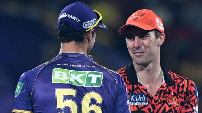 Starc and Pat Cummins share a moment after the IPL final. Picture: R.Satish Babu/AFP