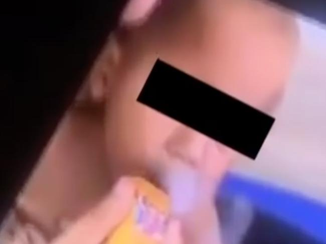 A distressing video of an 11-month-old baby boy smoking a vape. Picture: 7 NEWS