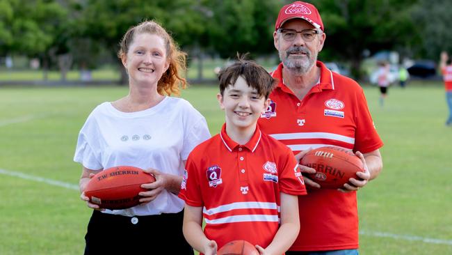 FABULOUS FOOTY: Human Nature program manger, Jen Parke, with talented Lismore Swans junior player Zack Connelly and Lismore Swans committee member David Bowker after the cub donated a huge of footballs to the outdoor mental health program. Daniel Cohen / dcsportsphotography