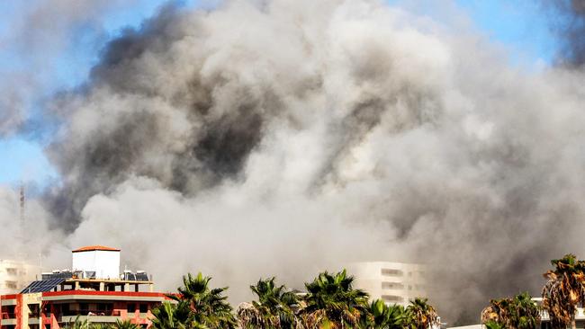 A smoke cloud covers buildings following the strike on Tyre. Picture: AFP.