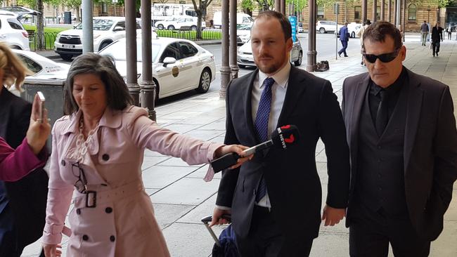 Dean Anthony Edwards, right, outside the District Court after receiving a suspended sentence for explosives offending. Picture: Sean Fewster