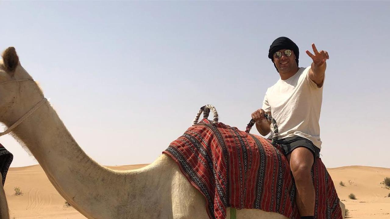 Hayne rides a camel in Dubai on his Middle Eastern sojourn.