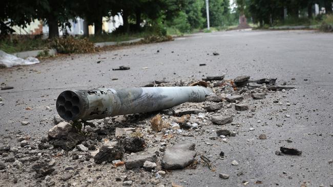 A missile is lodged in the pavement of a street in Lysychansk, Ukraine. Few residents remain in the city as it undergoes frequent shelling from Russian troops who are in a fierce battle for Severodonetsk, which sits across the river. Picture: Scott Olson/Getty Images