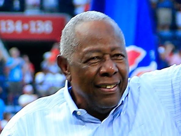 (FILES) In this file photo taken on October 02, 2016, Hall of Famer Hank Aaron throws out the ceremonial last pitch at Turner Field to Bobby Cox after the game between the Atlanta Braves and the Detroit Tigers at Turner Field in Atlanta, Georgia. - Hank Aaron, the baseball great who  defied racist hatred to break Babe Ruth's cherished major league home run record, died January 22, 2021. He was 86. The Atlanta Braves, Aaron's former club, and Major League Baseball said the beloved Hall of Famer affectionately known as 