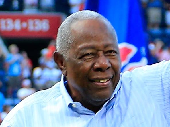 (FILES) In this file photo taken on October 02, 2016, Hall of Famer Hank Aaron throws out the ceremonial last pitch at Turner Field to Bobby Cox after the game between the Atlanta Braves and the Detroit Tigers at Turner Field in Atlanta, Georgia. - Hank Aaron, the baseball great who  defied racist hatred to break Babe Ruth's cherished major league home run record, died January 22, 2021. He was 86. The Atlanta Braves, Aaron's former club, and Major League Baseball said the beloved Hall of Famer affectionately known as "Hammerin' Hank" passed away Friday morning. (Photo by Daniel Shirey / GETTY IMAGES NORTH AMERICA / AFP)