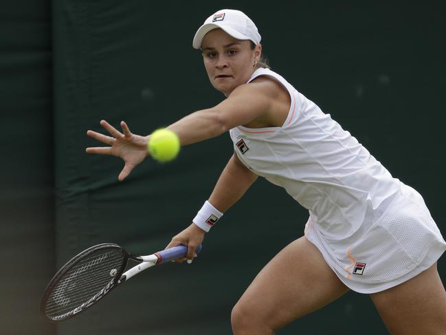 Australia's Ashleigh Barty returns the ball to United States' Alison Riske in a women's singles match during day seven of the Wimbledon Tennis Championships in London, Monday, July 8, 2019. (AP Photo/Ben Curtis)