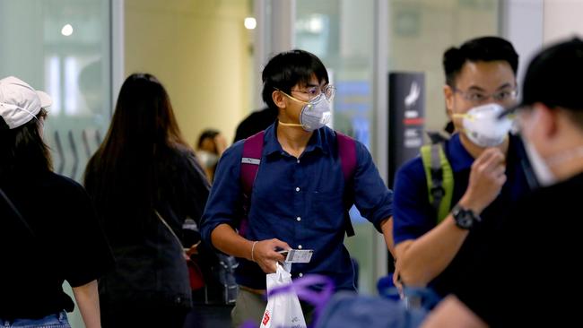 International students from a Thai Airways Flight arriving the Brisbane International Airport before starting their university courses. AAPimage/David Clark