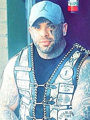Fornaciari’s arm tattoos visible under his vest.