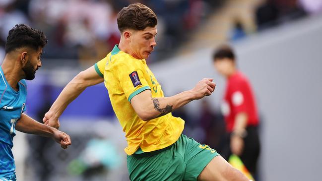 DOHA, QATAR - JANUARY 13: Jordan Bos of Australia is challenged by Nikhil Chandrashekhar of India during the AFC Asian Cup Group B match between Australia and India at Ahmad Bin Ali Stadium on January 13, 2024 in Doha, Qatar. (Photo by Robert Cianflone/Getty Images)