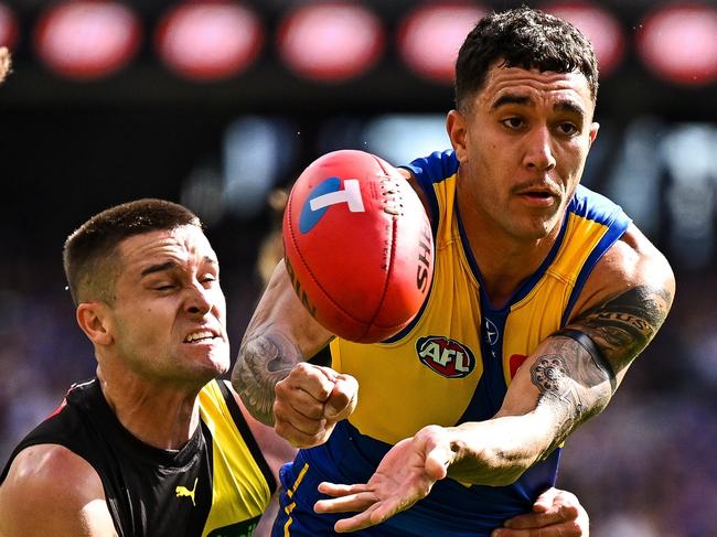 PERTH, AUSTRALIA - APRIL 14: Tyler Brockman of the Eagles handpasses the ball during the 2024 AFL Round 05 match between the West Coast Eagles and the Richmond Tigers at Optus Stadium on April 14, 2024 in Perth, Australia. (Photo by Daniel Carson/AFL Photos via Getty Images)