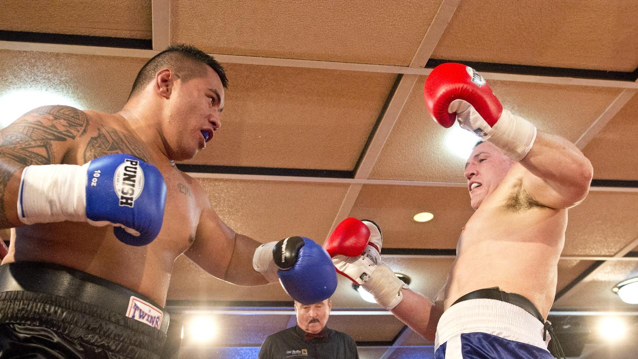 Paul Gallen and Herman Ene-Purcell fight it out in Toowoomba. Friday, Jan 29, 2016.