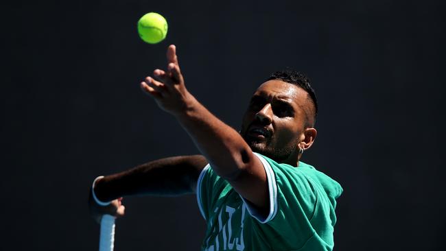 Nick Kyrgios practises his serves during a practice session at Melbourne Park.