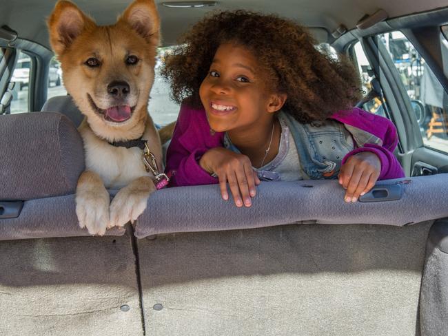 Best friends ... Quvenzhané Wallis in a scene from the movie Annie.