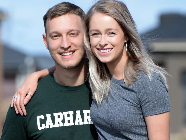 Jess Cosaitis, 25, and his partner Tess Walker, 26, at their recently purchased four bedroom home. Picture: Andrew Henshaw