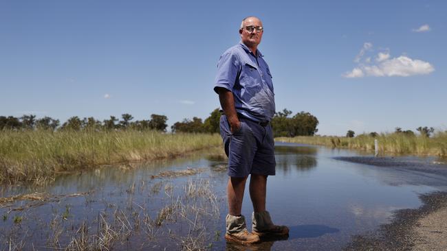 Farmer Scott Darcy at his flooded farm near Forbes. Picture: Jonathan Ng