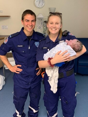 Paramedics Thomas Hawkins and Ashlee Brown with baby Jocelyn Osmond shortly after her dramatic homebirth.