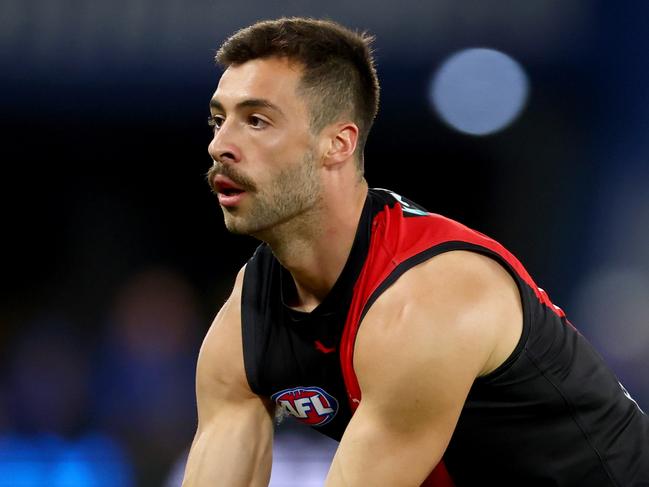 MELBOURNE, AUSTRALIA - MAY 01: Kyle Langford of the Bombers handballs during the round eight AFL match between Essendon Bombers and North Melbourne Kangaroos at Marvel Stadium, on May 01, 2025, in Melbourne, Australia. (Photo by Josh Chadwick/Getty Images)