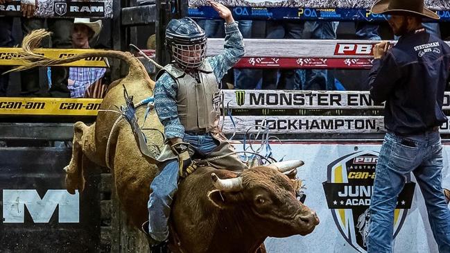 Chase Wieland is an 11-year-old junior champion bull rider from Bells Bridge who trains at home on his mechanical bull under the watchful eye of his dad, Malcolm Wieland. PHOTO: Supplied