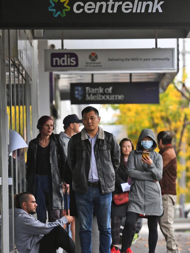 Queues outside Centrelink continue to grow. Picture: AFP