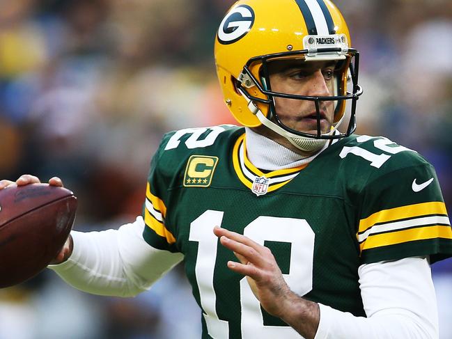 GREEN BAY, WI - DECEMBER 28: Aaron Rodgers #12 of the Green Bay Packers looks to pass against the Detroit Lions in the first quarter at Lambeau Field on December 28, 2014 in Green Bay, Wisconsin. Chris Graythen/Getty Images/AFP == FOR NEWSPAPERS, INTERNET, TELCOS & TELEVISION USE ONLY ==