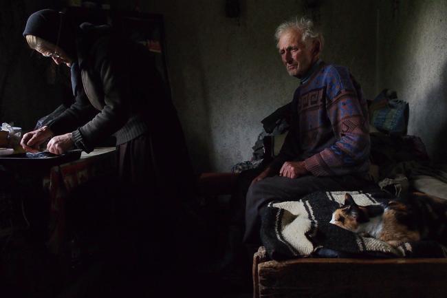 2014 National Geographic Photography Contest ... Honorable Mention People Photo: “Waiting”. He was waiting on the bed, lost in thoughts, while his wife was preparing the bread to be blessed for the orthodox Eucharist.. Location: village of sarbi, Maramure (Romania). Picture: Roberto Fiore / National Geographic 2014 Photo Contest