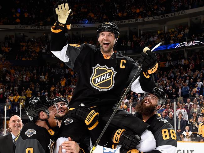 John Scott is shouldered off after the Pacific division’s All-Star win.