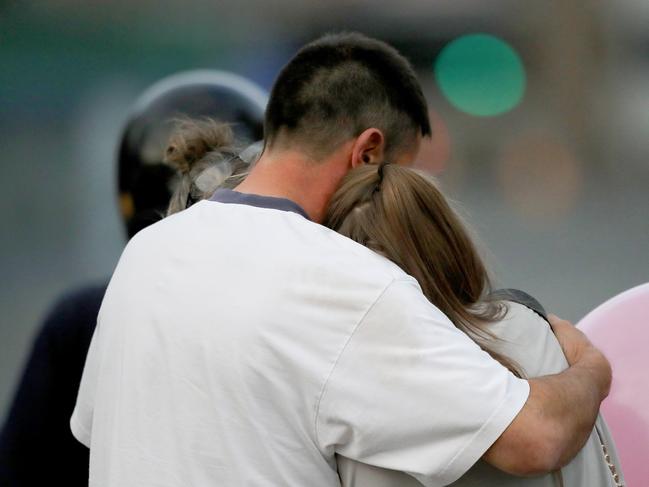 MANCHESTER, ENGLAND - MAY 23:  A man embraces a woman and a teenager as he collects them from the Park Inn Hotel where they were given refuge after last nights explosion at the Manchester Arena on May 23, 2017 in Manchester, England.  An explosion occurred at Manchester Arena as concert goers were leaving the venue after Ariana Grande had performed.  Greater Manchester Police have confirmed 19 fatalities and at least 50 injured. (Photo by Christopher Furlong/Getty Images)