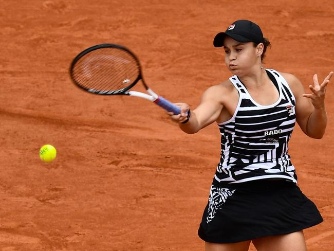 Australia's Ashleigh Barty returns the ball to Amanda Anisimova of the US during their women's singles semi-final match. Picture: AFP