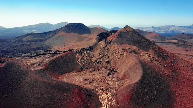 The volcanic landscape of Timanfaya National Park in Lanzarote, Canary Islands.