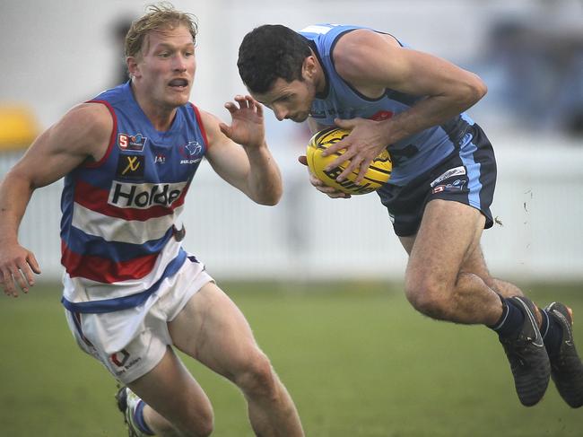 SANFL: Sturt v Central District at Unley Oval. Sturt's Matt Crocker, gets away from Central's  Travis Schiller. 2 June 2019. (AAP Image/Dean Martin)