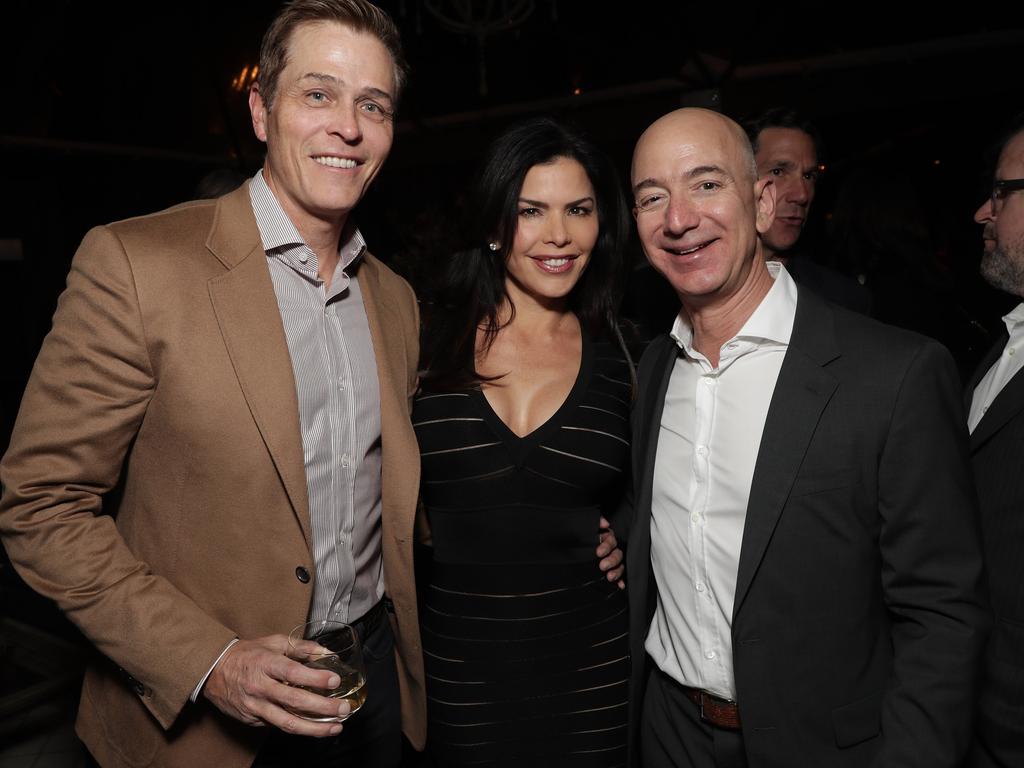 Patrick Whitesell, Lauren Sanchez and Amazon CEO Jeff Bezos attend Jeff Bezos and Matt Damon's ‘Manchester By The Sea’ Holiday Party in LA in 2016. Picture: Todd Williamson/Getty Images for Amazon Studios