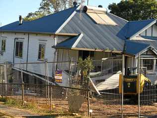 A house in South Lismore appears to have lost structural support and fallen. Picture: Marc Stapelberg