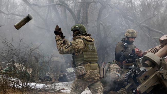 Ukrainian artillerymen fire an L119 howitzer towards Russian positions at a front line in the Lugansk region this week.