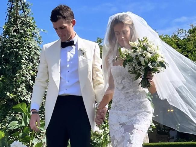 Newlywed couple Hamish Baillieu and Sacha De Winter walk down the aisle after tying the knot.