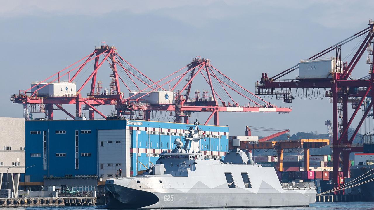 A Taiwanese Navy ship sails in the harbour in Keelung on December 11 amid escalating tensions with China. (Photo by I-Hwa CHENG / AFP)