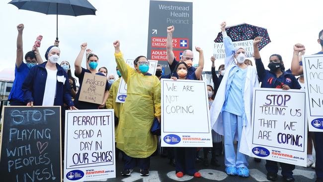 Intensive care unit nurses get their message across outside Westmead Hospital in Sydney on Wednesday. Picture: John Feder