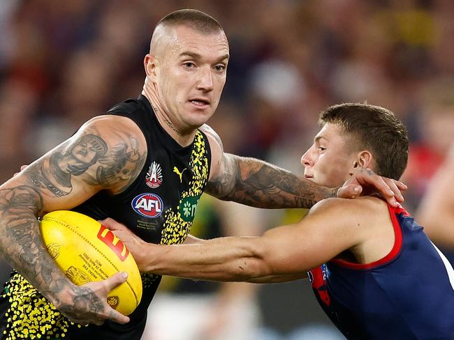 MELBOURNE, AUSTRALIA - APRIL 24: Dustin Martin of the Tigers is tackled by Judd McVee of the Demons during the 2023 AFL Round 06 match between the Melbourne Demons and the Richmond Tigers at the Melbourne Cricket Ground on April 24, 2023 in Melbourne, Australia. (Photo by Michael Willson/AFL Photos via Getty Images)