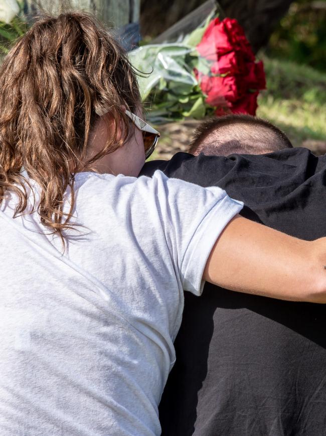 Devastated friends support one another in Freshwater. Picture: Monique Harmer