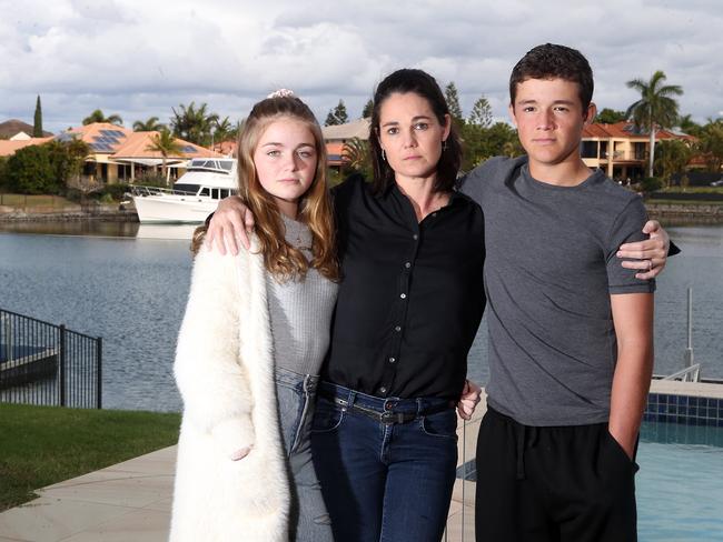 Sandra Brant, pictured with children Allegra and Connor at their Helensvale home, is chasing almost $30,000 in unpaid entitlements from former employer BLK. Picture: Richard Gosling