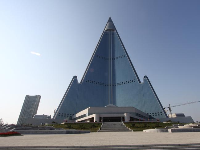 In this Sept. 23, 2012 photo released by Koryo Group on Wednesday, Sept. 26, 2012, the pyramid-shaped, 105-story Ryugyong Hotel stands in Pyongyang, North Korea. A foreign tour agency said the interior of the massive, hotel in the North Korea capital remains unfinished. Beijing-based Koryo Tours got a sneak peek inside the hotel that has been an off-limits construction site and remains a source of fascination for the outside world. (AP Photo/Koryo Group) NO SALES EDITORIAL USE ONLY