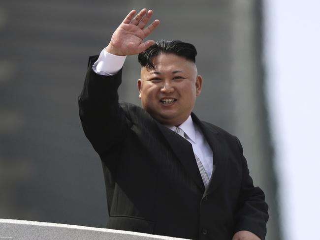 North Korean leader Kim Jong Un waves during a military parade. Picture: AP