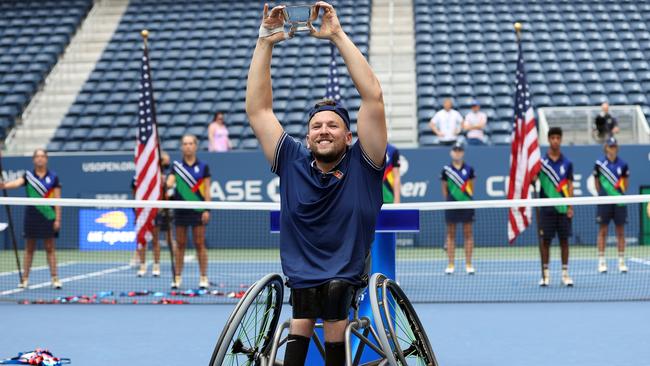 Dylan Alcott of Australia celebrates with the championship trophy