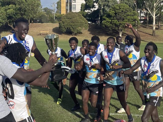 The South Sudan side celebrate after taking out the AFI World 9s at Box Hill Rugby Club.