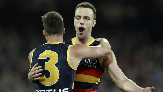 AFL — Round 18 — Adelaide Crows v Essendon at Adelaide Oval. Brodie Smith celebrates his goal with Riley Knight. Picture: Sarah Reed