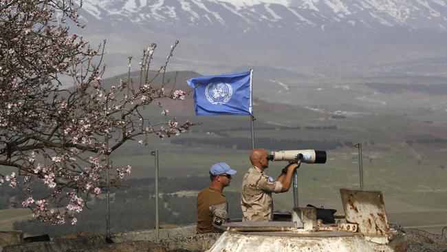 UN monitors keep an eye on the Syrian-Israeli border from a post in the Golan Heights. Picture: AFP