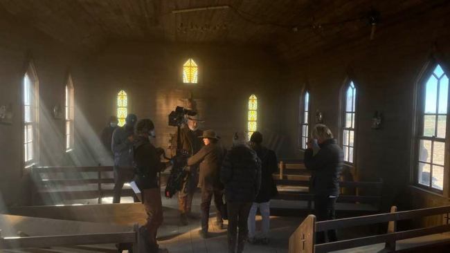 Svetnoy was setting up lighting inside a church building as the crew prepared to shoot the scene. Picture: Facebook