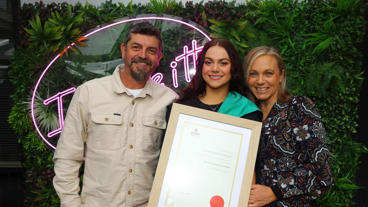 Deakin graduate Georgia Bromley with parents Dustin and Michelle. Picture: Alison Wynd