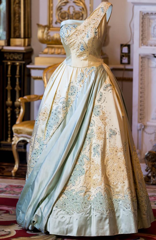 A pale blue and gold evening dress by Sir Norman Hartnell, worn by the Queen on a state visit to The Netherlands in 1958. Picture: Ian Gavan/Getty Images.