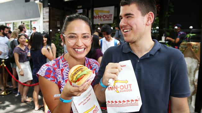 PMasaya Arellano and Haris Kruskic enjoying the In 'n' Out Burger Pop Up at Dead Ringer in Surry Hills yesterday.